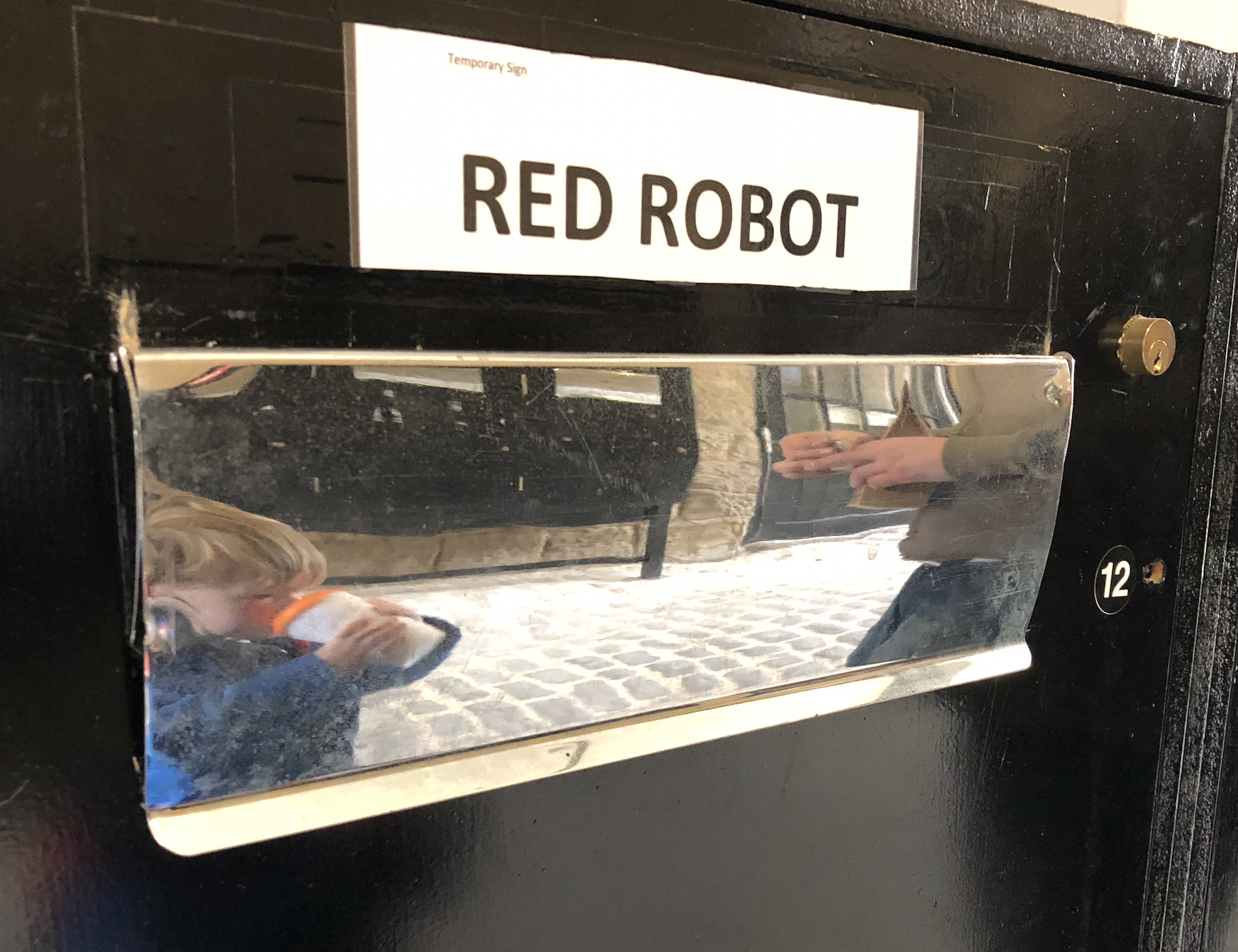Letterbox with Red Robot sign above it
